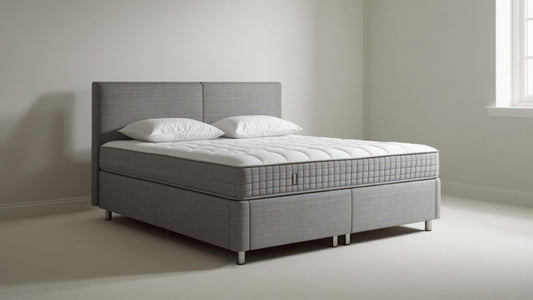 Elegant grey upholstered divan storage bed in a modern UK bedroom