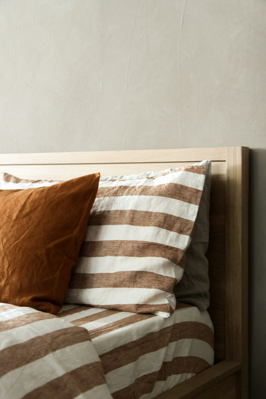 Upholstered wingback bed frame in a bright bedroom