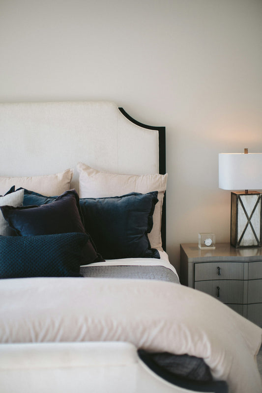 Cosy neutral bedroom with two pillows on the bed