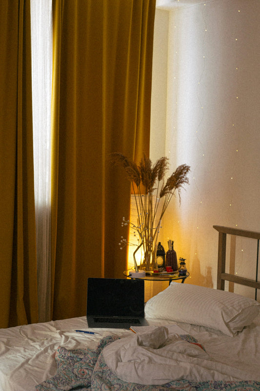 Laptop on a bed in a teenager's bedroom