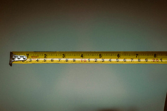Tape measure held in hand for room planning