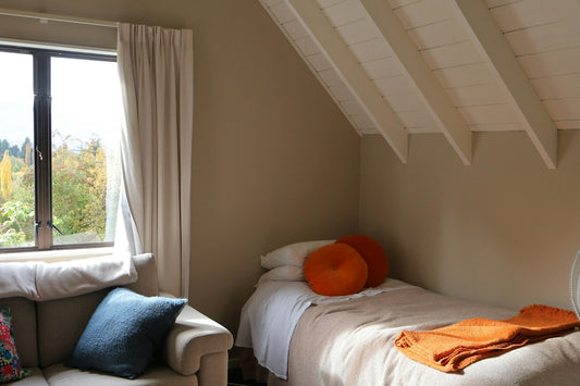 Cosy small bedroom with a single bed and window view